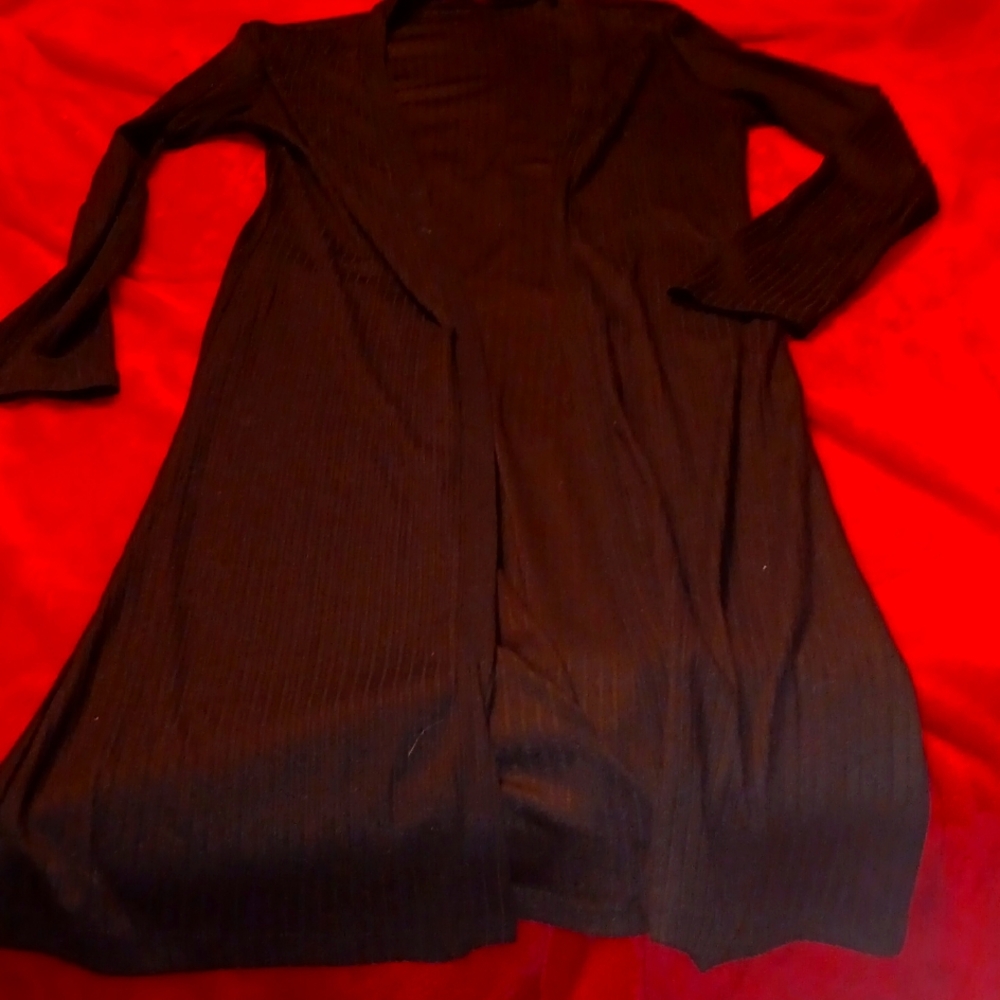 Black long-sleeved open front duster.